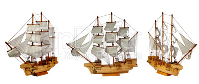 Model of ship with sails on the white background