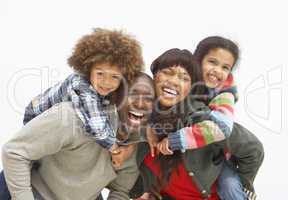 Young Family Relaxing On Beach Camping Holiday