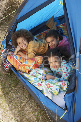 Children Having Fun Inside Tent On Camping Holiday