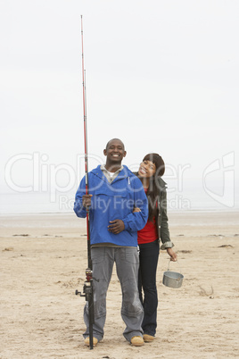 Couple Fishing On Beach