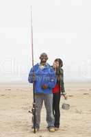 Couple Fishing On Beach