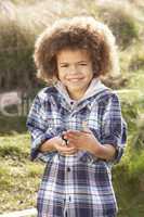 Young Boy Holding Worm Outdoors