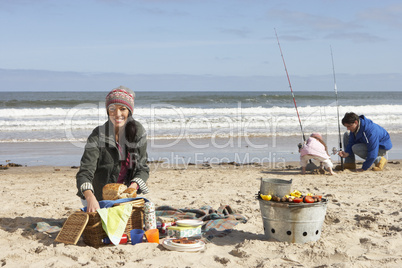 Family Having Picnic On Winter Beach