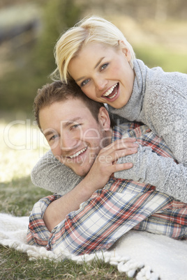 Portrait Of Romantic Young Lying On Grass