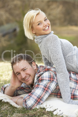 Portrait Of Romantic Young Lying On Grass