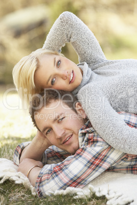 Portrait Of Romantic Young Lying On Grass