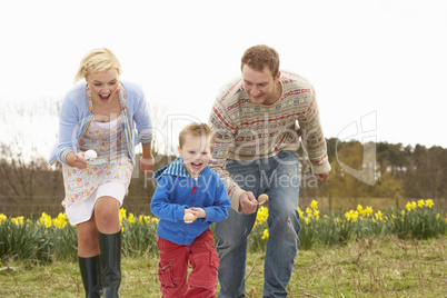 Family Having Egg And Spoon Race