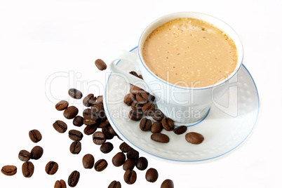 coffee mug against the backdrop of coffee beans