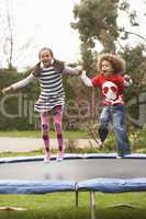 Children Playing On Trampoline