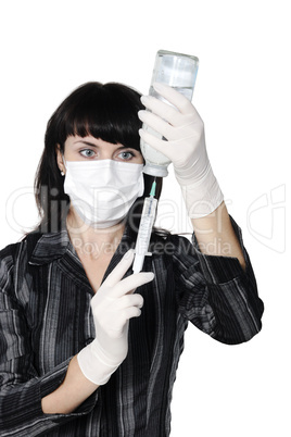 Medicine doctor with medical syringe in hands