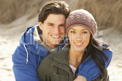 Romantic Young Couple On Winter Beach