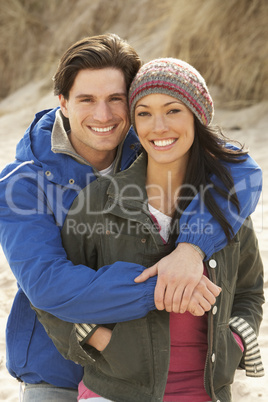 Romantic Young Couple On Winter Beach