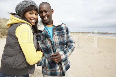 Romantic Young Couple On Winter Beach