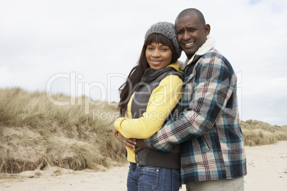 Romantic Young Couple On Winter Beach