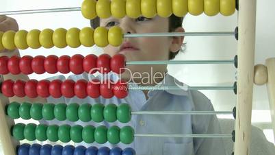 Little Boy using abacus