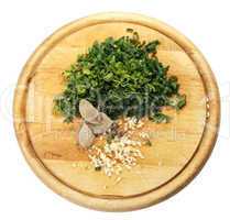 Fennel, parsley, garlic, bay leaf on the chopping board