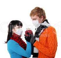 man embraces a woman wearing masks, flu,