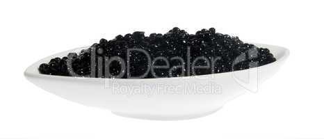 Black caviar in a white plate