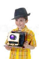Little boy with an old camera