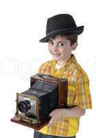 Little boy with an old camera