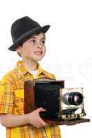 Little boy with an old camera