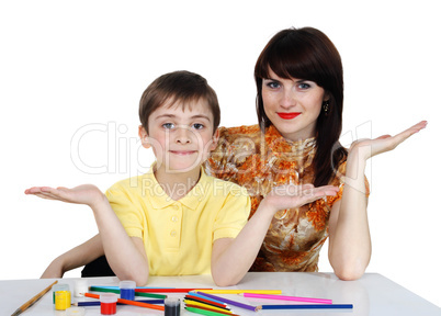 small boy and a young girl with colored pencils