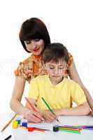 small boy and a young girl with colored pencils