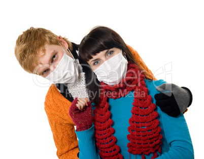 man embraces a woman wearing masks, flu,