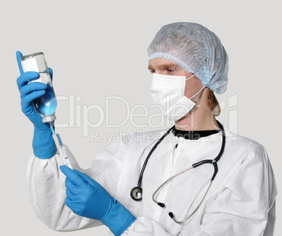 Medicine doctor with medical syringe in hands