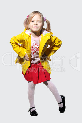 Little girl in a yellow jacket