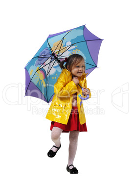 Little girl in a yellow jacket with an umbrella