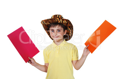 boy with colored paper in his hands