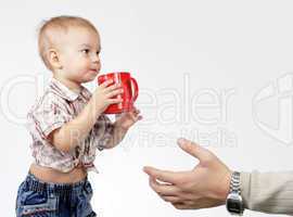 Dad takes a little son a red cup