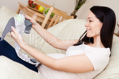 Happy pregnant caucasian brunette