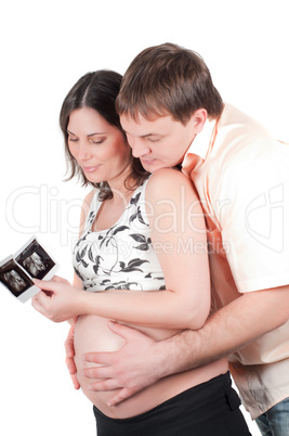 Couple holding a sonogram of their child