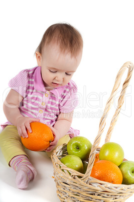 Baby girl in pink and fruits