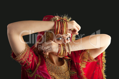young girl in red indian costume closeup portrait