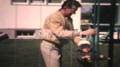 Dad Pushes Little Boy On Swing (1963 - Vintage 8mm film)