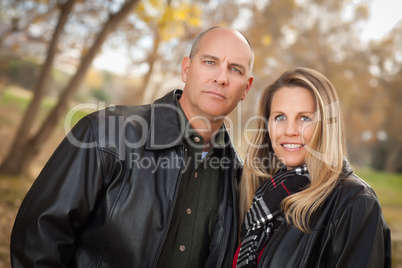 Attractive Couple in Park with Leather Jackets