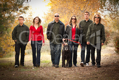 Attractive Family Portrait Walking Outdoors