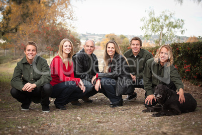 Attractive Family Pose for a Portrait Outdoors