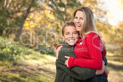 Playful Mother and Son Pose for a Portrait Outdoors