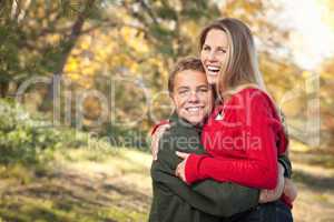 Playful Mother and Son Pose for a Portrait Outdoors