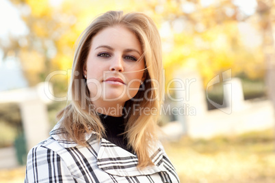 Pretty Young Woman Smiling in the Park
