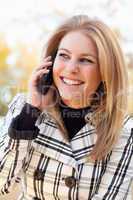 Pretty Young Blond Woman on Phone Outside