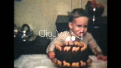 Little Boy Blows Out Candles On Cake (1964 Vintage 8mm film)