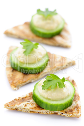 Appetizer of pita with hummus and cucumber