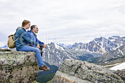 Father and daughter in mountains