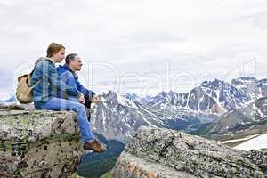 Father and daughter in mountains