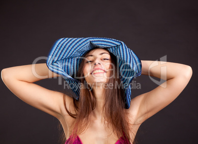 Cheerful pretty young girl with smiling face in cap